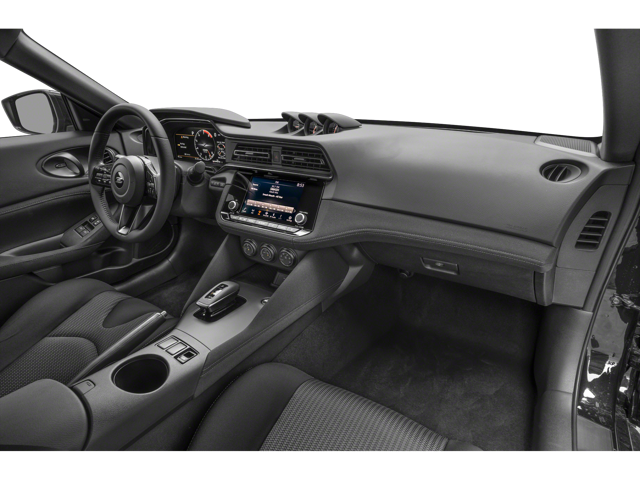 Interior view of a dark grey sports car, showing the dashboard, steering wheel