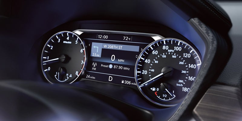 A car's instrument cluster showing a speedometer