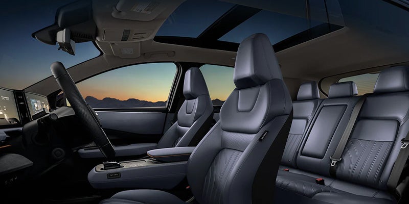An interior shot of a car, showing the front passenger and back seats